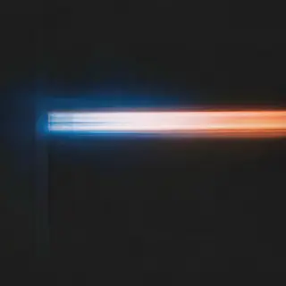 A cinematic frame with blue and orange anamorphic lens flare