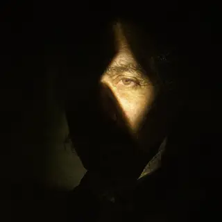 A portrait lit with classic Rembrandt lighting — triangle of