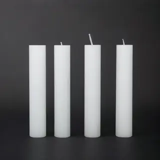 Exactly 4 white candles standing on a dark surface