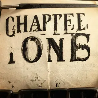 The word 'CHAPTER ONE' typed on aged paper with a vintage ty