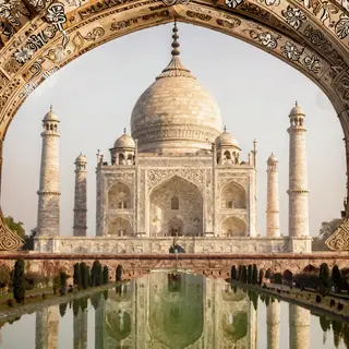 The Taj Mahal in Agra seen from the reflecting pool, with ac