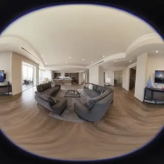 A wide-angle shot of a modern living room interior showing e