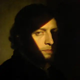 A portrait lit with classic Rembrandt lighting — triangle of