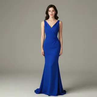 A woman wearing a royal blue evening dress against a neutral