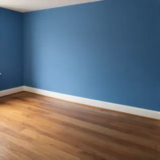 A room with walls in #4A90D9 (medium blue) with warm wooden 