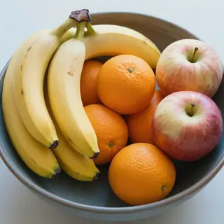 A fruit bowl containing exactly 3 bananas, 4 oranges, and 2 