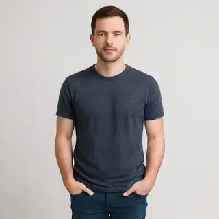 A man standing straight facing the camera, hands in pockets,