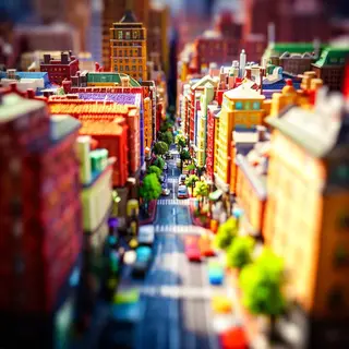 A tilt-shift photograph of a city street making real-life lo