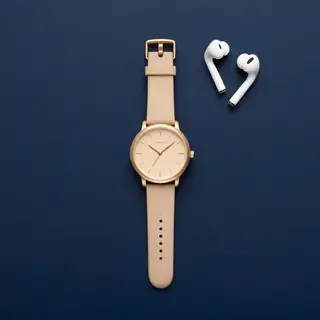 A product flat-lay on a #1A1A2E (deep dark blue) background,