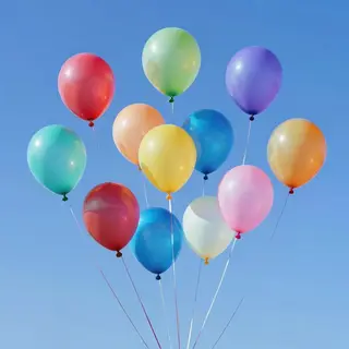 Exactly 11 colorful balloons floating against a clear blue s