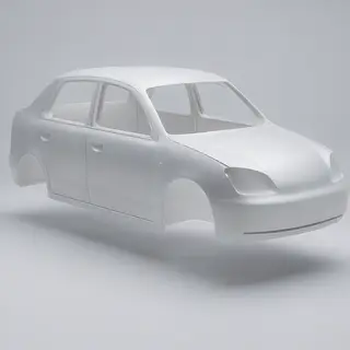 A car body with windows, doors, and headlights but no wheels