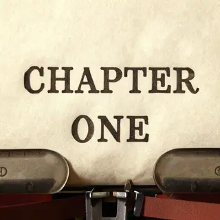 The word 'CHAPTER ONE' typed on aged paper with a vintage ty