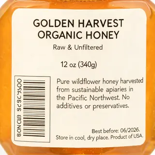 A product label for 'GOLDEN HARVEST ORGANIC HONEY' with subt
