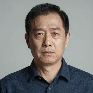 A portrait of a middle-aged man with a calm, serious express