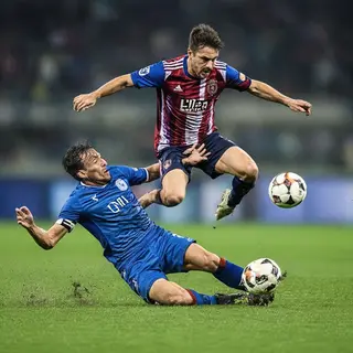 Two soccer players mid-tackle, one sliding and the other jum