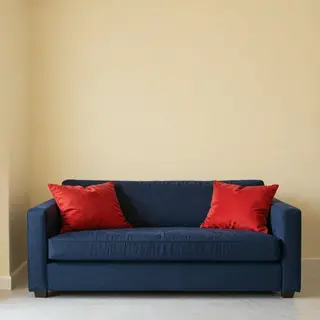 A minimalist room with walls in #F5E6CC (warm cream), a sofa