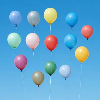 Exactly 11 colorful balloons floating against a clear blue s