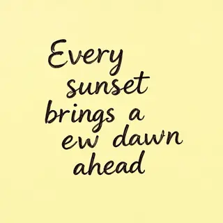 'Every sunset brings a new dawn ahead' written neatly on a p