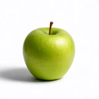 A ripe green apple on a seamless white background with soft 