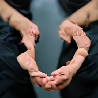 Two people shaking hands in a professional setting, all fing