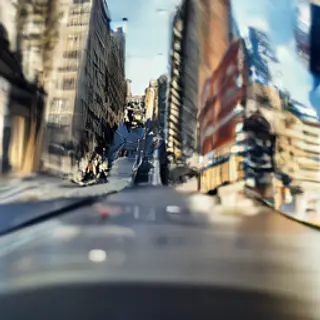 A tilt-shift photograph of a city street making real-life lo