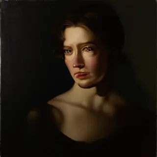 A portrait lit with classic Rembrandt lighting — triangle of