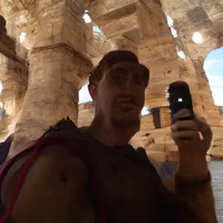 A Roman gladiator taking a selfie with a smartphone in the C