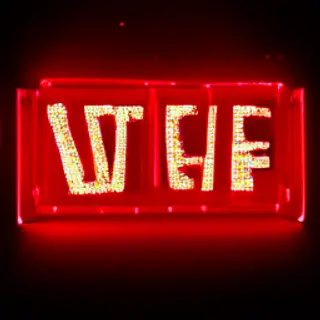 The word 'OPEN' displayed on a red LED sign with glowing pix