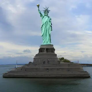 The Statue of Liberty on her island pedestal, with correct t