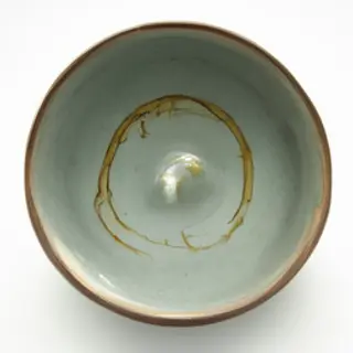 A Japanese kintsugi bowl — cracked ceramic repaired with vis