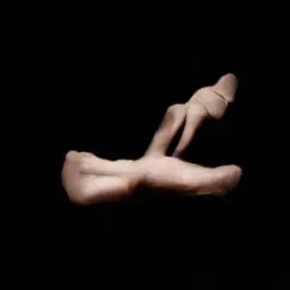A hand giving a thumbs-up with four fingers curled and thumb