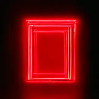 The word 'OPEN' displayed on a red LED sign with glowing pix