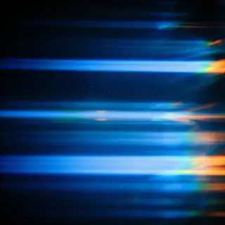 A cinematic frame with blue and orange anamorphic lens flare