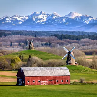 A landscape with a red barn in the foreground at large scale