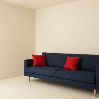 A minimalist room with walls in #F5E6CC (warm cream), a sofa