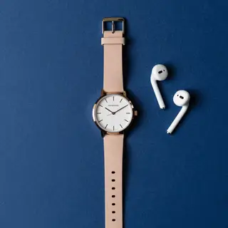 A product flat-lay on a #1A1A2E (deep dark blue) background,