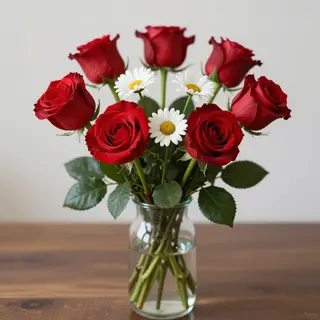 4 red roses and 2 white daisies in a glass vase on a table