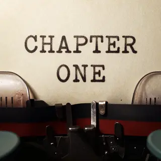 The word 'CHAPTER ONE' typed on aged paper with a vintage ty