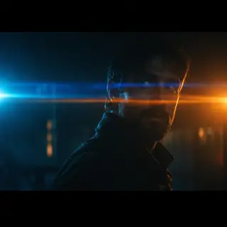 A cinematic frame with blue and orange anamorphic lens flare