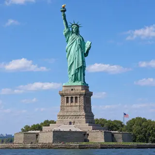 The Statue of Liberty on her island pedestal, with correct t