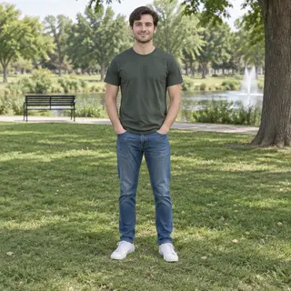 A person standing in a neutral pose in a park, full body vis