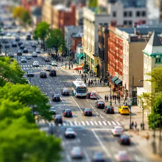 A tilt-shift photograph of a city street making real-life lo