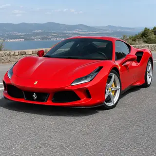A bright red sports car parked on a gray asphalt road — the 