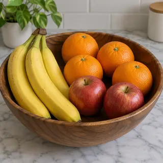 A fruit bowl containing exactly 3 bananas, 4 oranges, and 2 