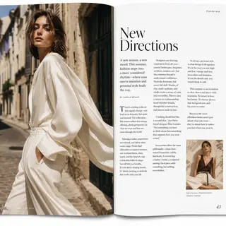 A fashion magazine spread with a full-bleed left-page photo,