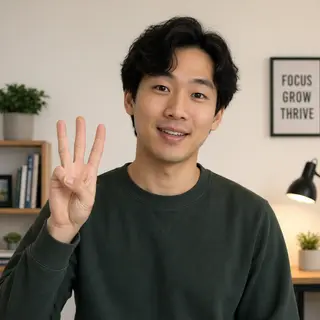 A person counting to three on their fingers, with index, mid