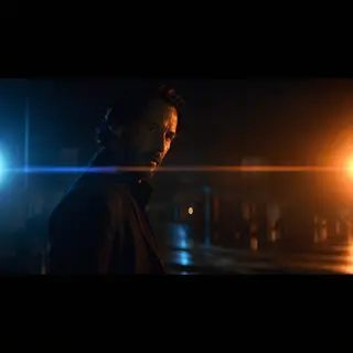 A cinematic frame with blue and orange anamorphic lens flare
