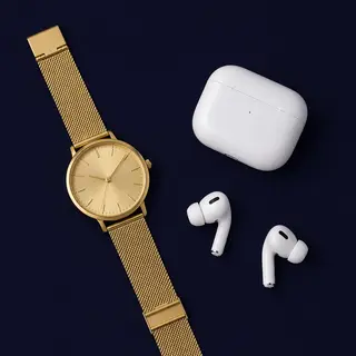 A product flat-lay on a #1A1A2E (deep dark blue) background,