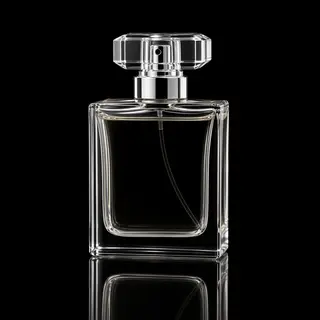 A clear glass perfume bottle on a reflective black surface w