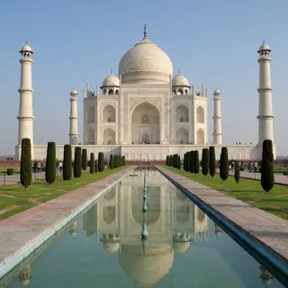 The Taj Mahal in Agra seen from the reflecting pool, with ac